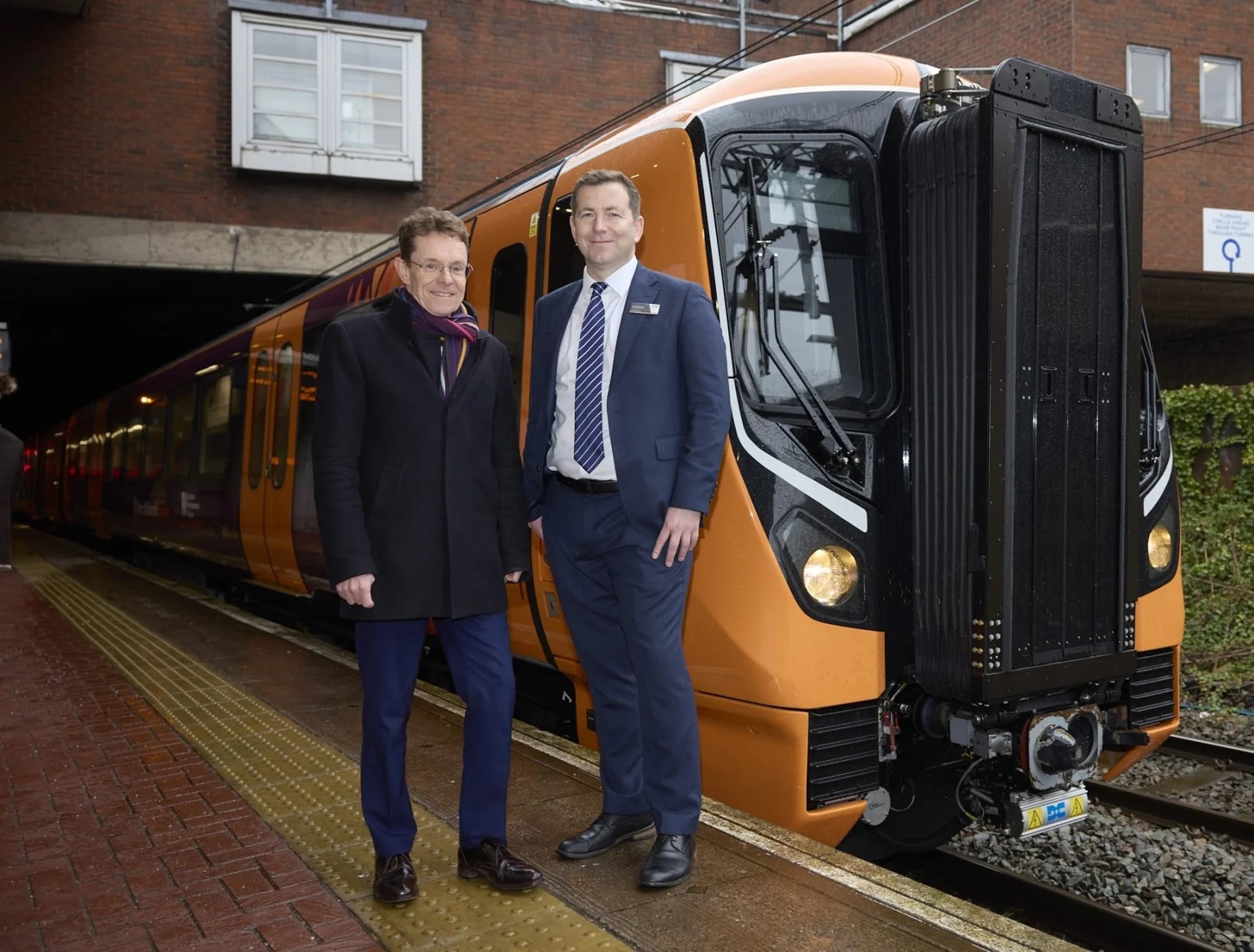 Mayor and West Midlands Railway managing director in front of one of the new class 730 trains